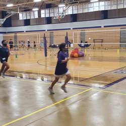 Lil' Spikers Volleyball Academy - Running a lap before warm ups.