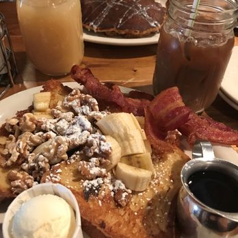 Toast - Banana walnut french toast in the front, carrot cake short stack pancakes in the back, grapefruit juice to the left, iced cappuccino right. - Breakfast & Brunch Near Me - Montclair, New Jersey