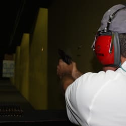 Sagittarius Marksmanship Services LLC - Yes, that is a bullet and ejected cartridge case in mid air.  I have my photographer-wife to thank for that.