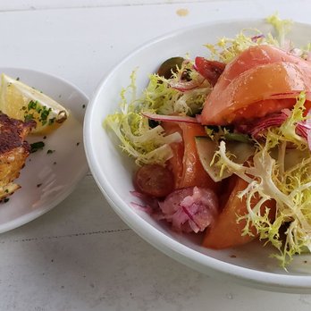 Matt's Fish Camp Lewes - Heirloom tomatoes & cucumber salad with a crab cake. - Seafood Near Me - Lewes, Delaware Matt's Fish Camp Lewes - Heirloom tomatoes & cucumber salad with a crab cake. - Seafood Near Me - Lewes, Delaware