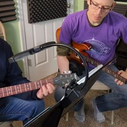 Guitar Lessons and More - Mark and I discussing the proper fingering of a D Chord.