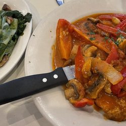 Bella Notte - Breaded veal cutlets pizzaiola with mushrooms, onions, peppers and garlic. Escarole in oil & garlic.