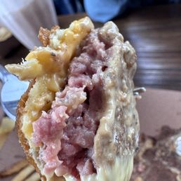 Undercooked burger. Witnessed 2 other guests go to the counter and complain. They had their items made again. Undercooked burger. Witnessed 2 other guests go to the counter and complain. They had their items made again.