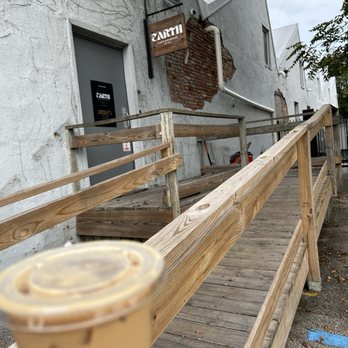 Earth Coffeehouse - Outside and iced vanilla latte - Coffee & Tea Near Me - Toledo, Ohio Earth Coffeehouse - Outside and iced vanilla latte - Coffee & Tea Near Me - Toledo, Ohio