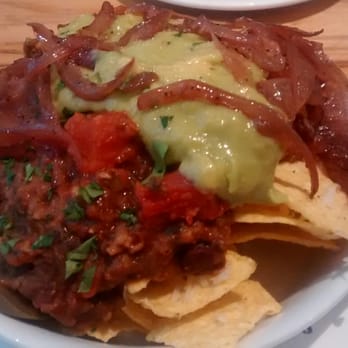 Henderson's - Nachos with veggie haggis, caramelised onion, vegan cheese, guacamole, hot salsa, (hold the jalapeños) - Vegetarian Near Me - Edinburgh, EDH Henderson's - Nachos with veggie haggis, caramelised onion, vegan cheese, guacamole, hot salsa, (hold the jalapeños) - Vegetarian Near Me - Edinburgh, EDH