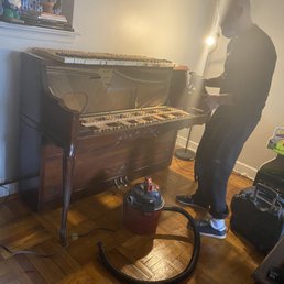 Pietro repairing the piano