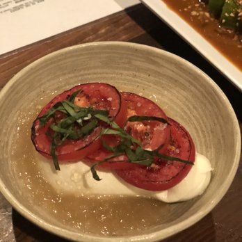 DOMU - BLACK TRUFFLE BURRATA FRESH MOZZARELLA INFUSED WITH BLACK TRUFFLES AND FILLED WITH CREAM, YUZU GELEE, TORCHED TOMATO, THAI BASIL - Ramen Near Me - Orlando, Florida