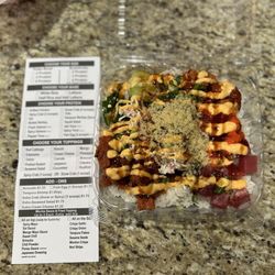 Ginza Ramen Poke and Boba - Spicy salmon, spicy tuna, and ahi tuna, jalapeño, scallions, snow crab, masago, spicy mayo and eel sauce, and tempura flakes