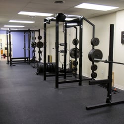 Two Rogue racks, squat stands, deadlift platform - photo by Glorianna Picini Photography