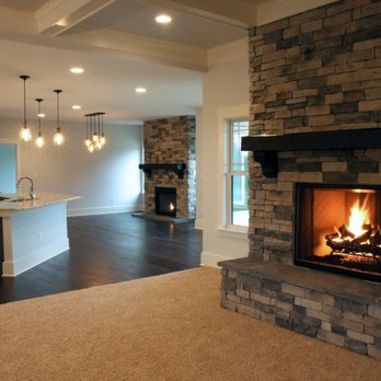 Joyner Homes - a fireplace in the middle of a living room - Home Developers Near Me - Greenfield, Indiana