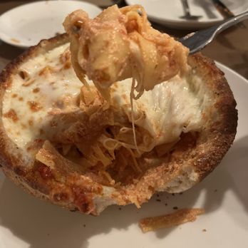 Italiano - Pappardelle pasta with red sauce mixed with ricotta in a bread bowl - Pizza Near Me - Bethpage, New York