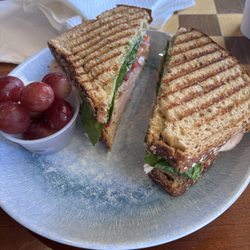 Love Mug Coffee Shop - Cabriolet sandwich (turkey, provolone, spinach, tomato, pickled onion, pesto, mayo, on wheat with grapes)