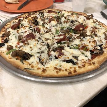 Amina Pizzeria - Looks good but had no flavor. :/ pictured here is a combinations pizza. All the meat toppings are halal - Pizza Near Me - Honolulu, Hawaii
