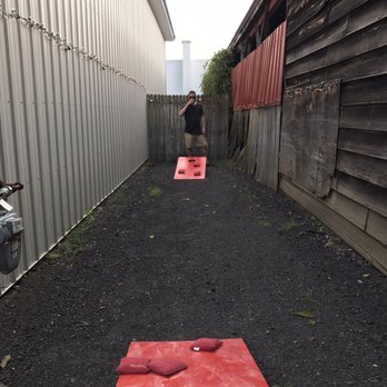 East Aurora Brewery - a red corn hole on the side of a building - Breweries Near Me - East Aurora, New York East Aurora Brewery - a red corn hole on the side of a building - Breweries Near Me - East Aurora, New York