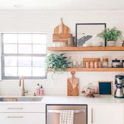 Simple touches go a long way. The backsplash, hardware, and floating shelves are simple, elegant, and modern