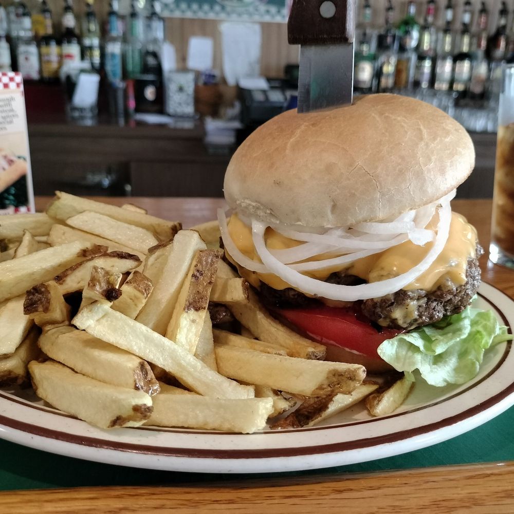 Roadside Bar & Grill - An undercooked burger accompanied by undercooked fries. - Sports Bars Near Me - Delevan, New York