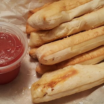 Lucian's Pizza - Breadsticks with marinara sauce. Well seasoned, fluffy, and delicious. - Pizza Near Me - Norwalk, California