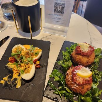 Waters Edge Winery & Bistro - Deviled egg (minus one) and arancini - Wine Bars Near Me - Dallas, Texas