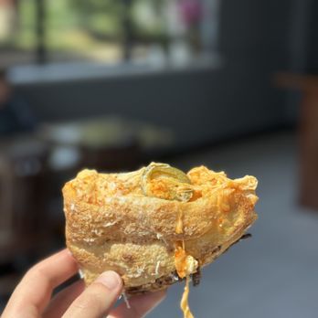 MiYORK East Coast Kitchen - a hand holding a pastry - Italian Near Me - Walled Lake, Michigan MiYORK East Coast Kitchen - a hand holding a pastry - Italian Near Me - Walled Lake, Michigan