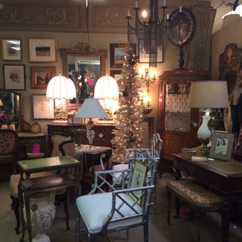 Antique Gatherings - Chairs, occasional tables, and antique mirrors galore in this shop.  This booth has a vintage bellman's cart for sale! - Antiques Near Me - Phoenix, Arizona