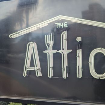 The Attic - Black and neon white sign says "The Attic" with the double "t" are designed as a fork & knife - Breakfast & Brunch Near Me - Long Beach, California The Attic - Black and neon white sign says "The Attic" with the double "t" are designed as a fork & knife - Breakfast & Brunch Near Me - Long Beach, California