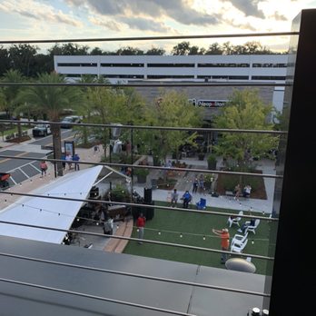 Spurrier's Gridiron Grille - Looking down at the bank outdoors - American Near Me - Gainesville, Florida Spurrier's Gridiron Grille - Looking down at the bank outdoors - American Near Me - Gainesville, Florida
