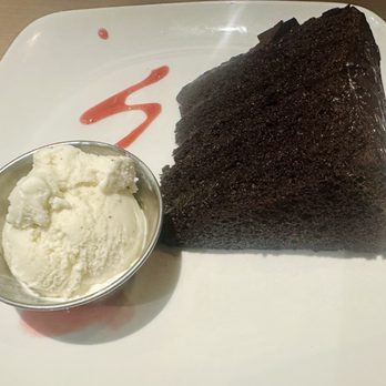 Firebirds Wood Fired Grill - Big Daddy Chocolate Cake served with Vanilla bean ice cream - Steakhouses Near Me - Omaha, Nebraska Firebirds Wood Fired Grill - Big Daddy Chocolate Cake served with Vanilla bean ice cream - Steakhouses Near Me - Omaha, Nebraska