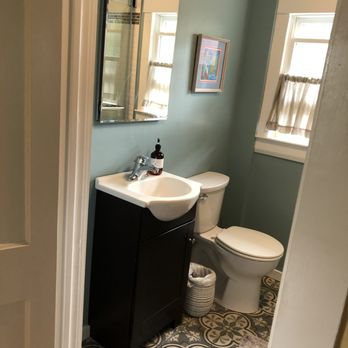 Cardoza Flooring - a bathroom with a sink and toilet - Flooring Near Me - Milford, New Hampshire