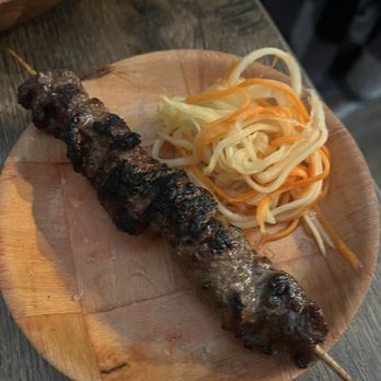 Mawn - grilled saht koh (8)-- lemongrass, ginger, galangal, marinated beef on a stick - Cambodian Near Me - Philadelphia, Pennsylvania Mawn - grilled saht koh (8)-- lemongrass, ginger, galangal, marinated beef on a stick - Cambodian Near Me - Philadelphia, Pennsylvania