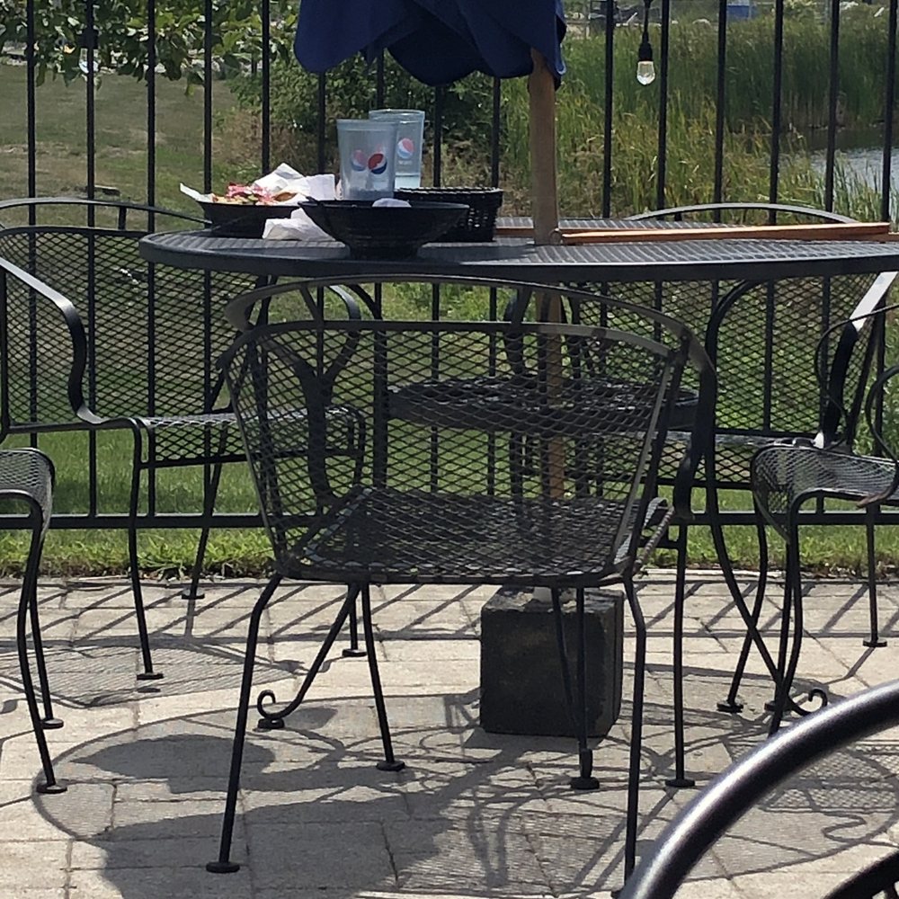Patio table not bussed in over an hour. Patio table not bussed in over an hour.