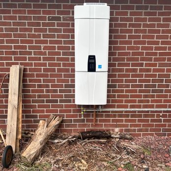Proper Plumbing - New exterior gas tankless water heater install, with bottom cover to conceal piping and valves from being visible! - Plumbing Near Me - Pace, Florida Proper Plumbing - New exterior gas tankless water heater install, with bottom cover to conceal piping and valves from being visible! - Plumbing Near Me - Pace, Florida