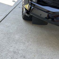 Tidal Wave Auto Spa - Damage to front bumper from improper guide onto wash rails.