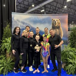 REGA Gymnastics - Acro Athletes and Coaches at competition in Canada