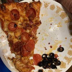 Round Table Pizza - A Thick Black curly Hair inside a funky tasting pizza