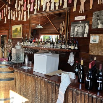 Hallcrest Vineyards - a bar with a lot of bottles of wine - Wine Tasting Room Near Me - Felton, California