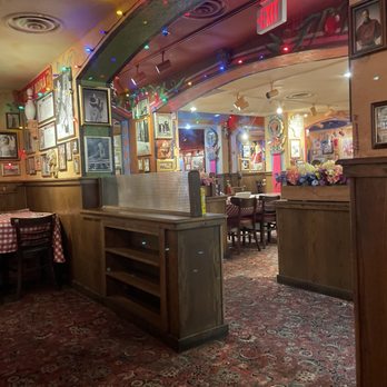 Buca di Beppo Italian Restaurant - Looking from the Wine Room into the next room. - Italian Near Me - Louisville, Kentucky Buca di Beppo Italian Restaurant - Looking from the Wine Room into the next room. - Italian Near Me - Louisville, Kentucky