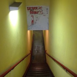 It's located on the first floor (Suite #123). Use these sketchy stairs to go downstairs.