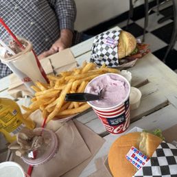 Large and small burgers and large fries to share. Large and small burgers and large fries to share.