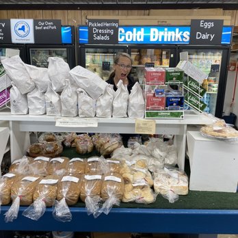 Peterson Farm - a woman behind a counter with bread - Fruits & Veggies Near Me - Jamestown, New York Peterson Farm - a woman behind a counter with bread - Fruits & Veggies Near Me - Jamestown, New York