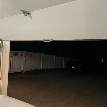 Lynoka Garage Door - Door in jammed position. Not easy to see when backing in to garage nor something that happens consistently - Garage Door Services Near Me - Braintree, Massachusetts