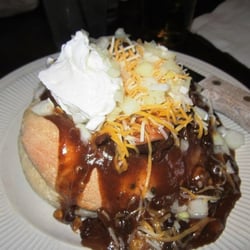Chicken Chili in a bread bowl with all of the fixings.