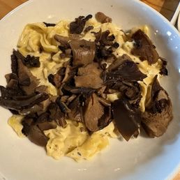 Homemade tagliatelle with Alfredo Puro sauce and mushrooms Homemade tagliatelle with Alfredo Puro sauce and mushrooms