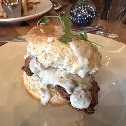 This picture does not do justice to the magnificence that is Sausage Gravy on Biscuits with a Fried Chicken Breast.