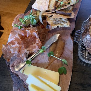 Heritage Tavern - Charcuterie board! We also got three spreads as well(a jam, a mustard, and an almond butter) thin chips, bread, a couple pickles and onions - New American Near Me - Madison, Wisconsin