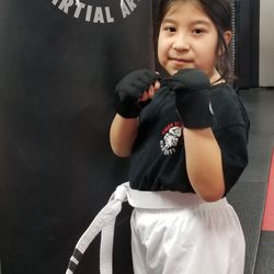 Tiger Schulmann's Martial Arts - Elmwood Park - Posing after getting her second strip.