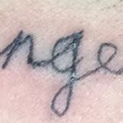 Packer's Tattoo - Scratchy tattoo, busted lines. Looks like a 3rd grader learning to write cursive.