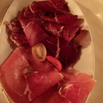 Basilic Restaurant - Assortment of hams, salami, prosciutto for the raclette night meat option - French Near Me - Newport Beach, California Basilic Restaurant - Assortment of hams, salami, prosciutto for the raclette night meat option - French Near Me - Newport Beach, California