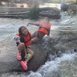 Tube-Chute - Enjoying the river near the second "chute" area (see the kid on the green tube in the back right coming down the chute!).