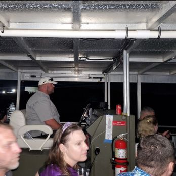 Galveston Haunted Harbor Tours - Guests settle in aboard the Haunted Harbor Tours boat as the captain takes the helm for a nighttime voyage... - Haunted Houses Near Me - Houston, Texas