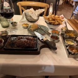 La Cabrera - Skirt Steak and Fries with many small sides and a beautiful Chilean Red